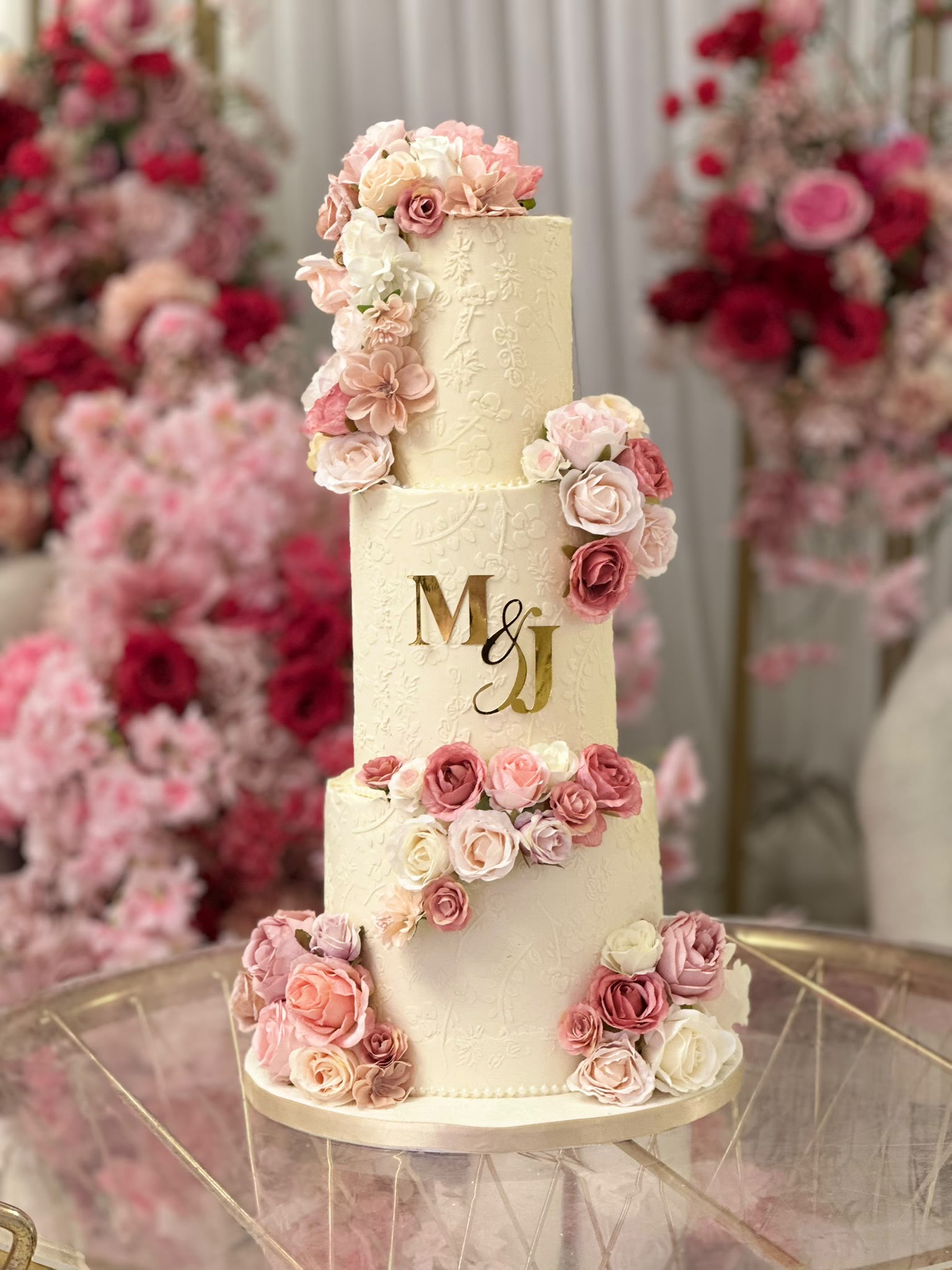 3 tier wedding cake with pink roses