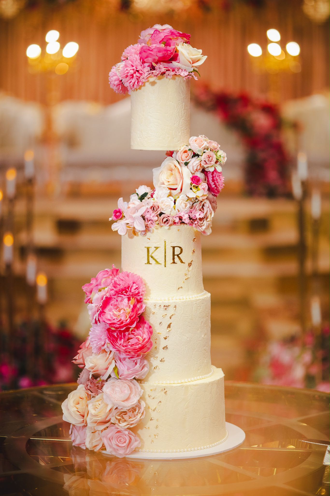5 tier wedding cake with pink peonies