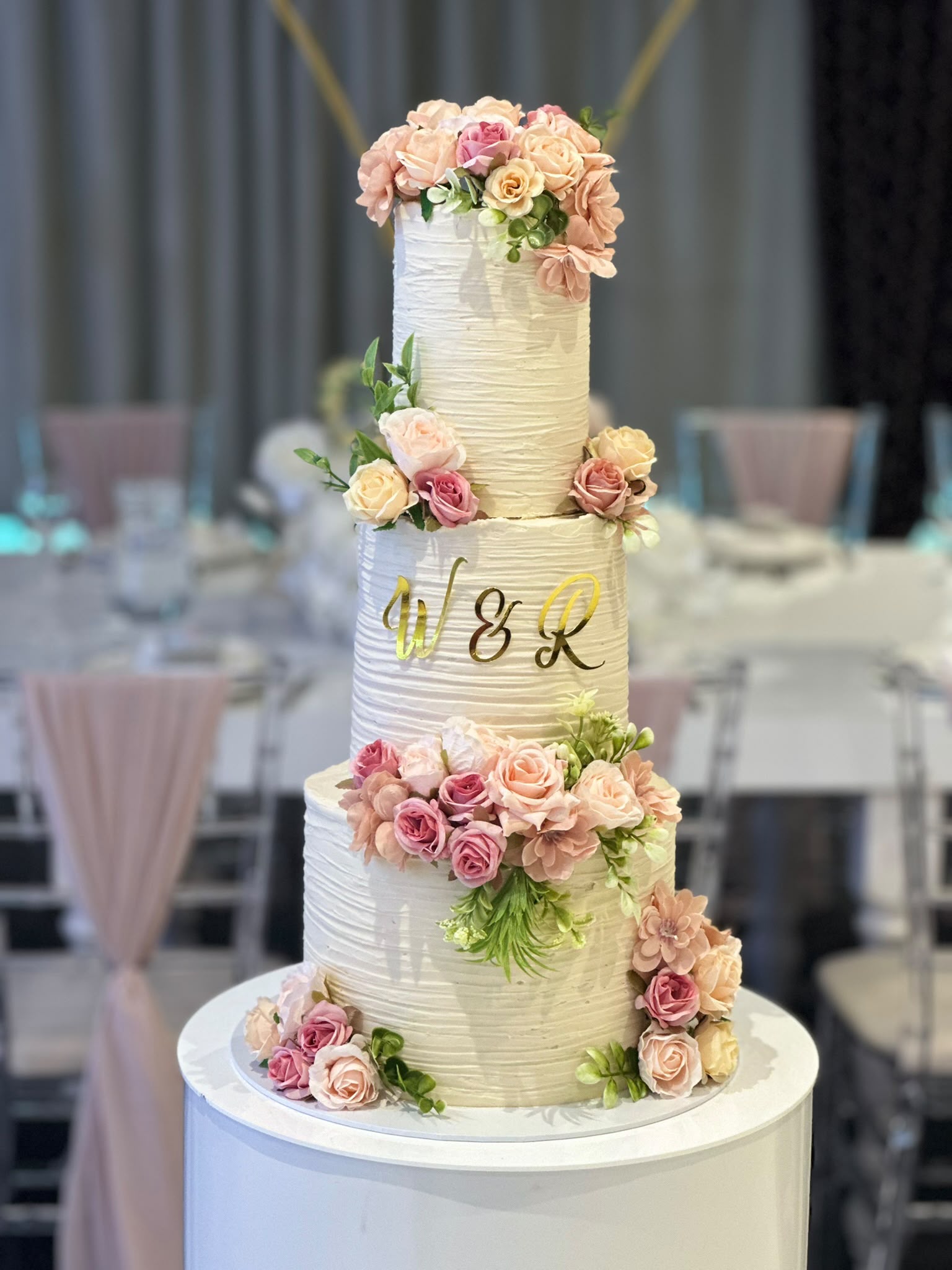 3 tier textured buttercream cake with blush flowers